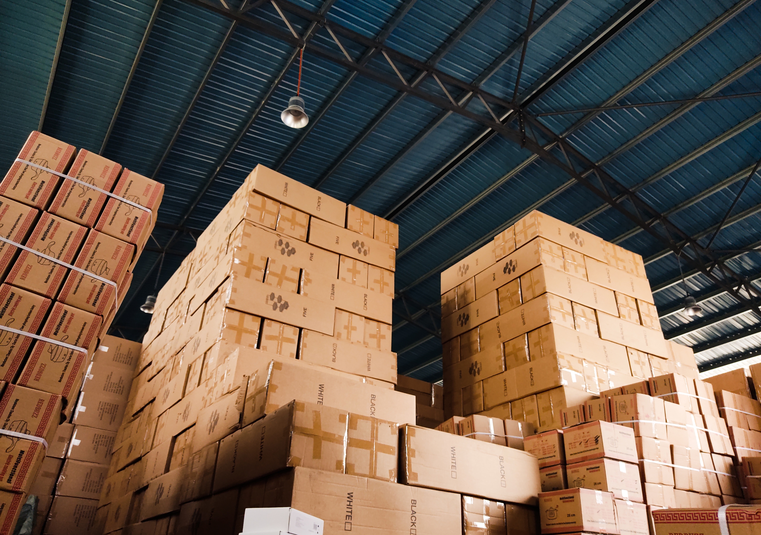 Palletised cartons stacked inside a Genex Logistics warehouse